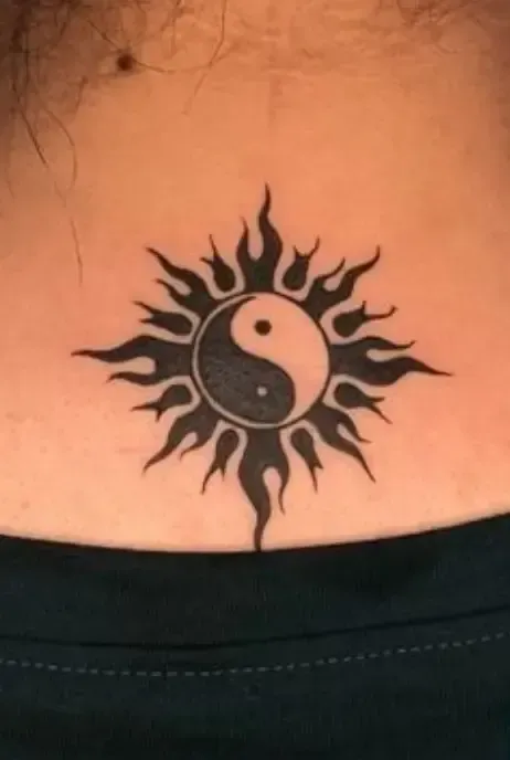 Magatama and sun tribal tattoo