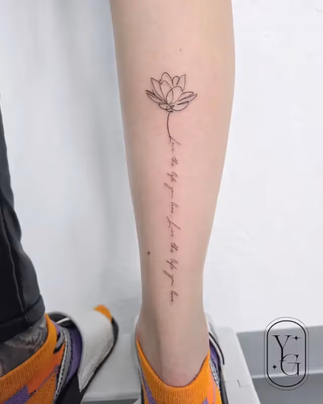 Flower and lettering tattoo