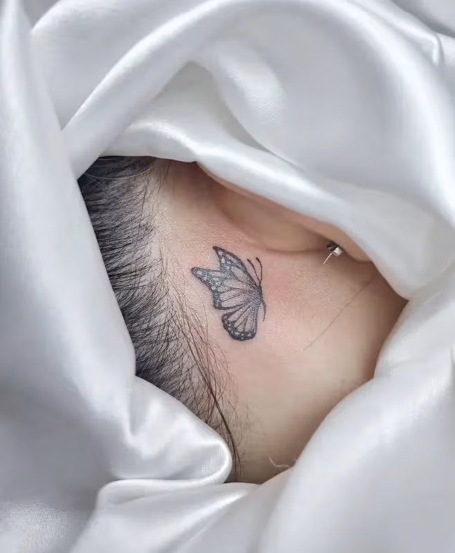 lettering tattoo behind the ear